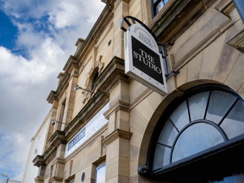 An exterior shot of The Studio, Bradford, looking up at a bright sky.